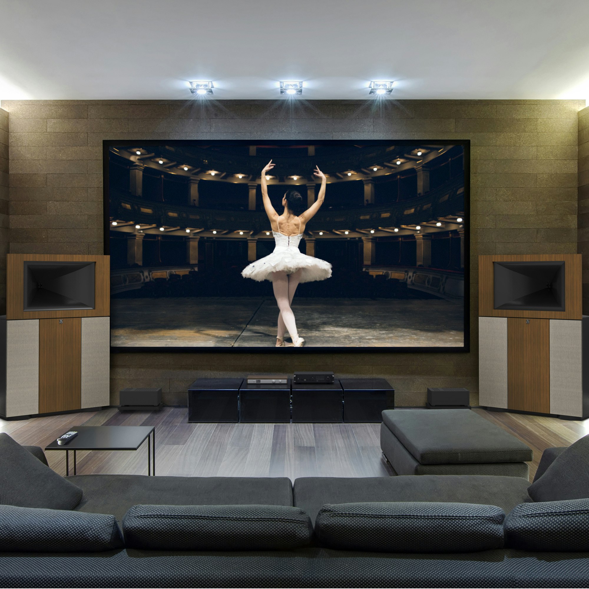 A pair of Klipsch Jubilees flanking a large TV with a ballerina on the screen